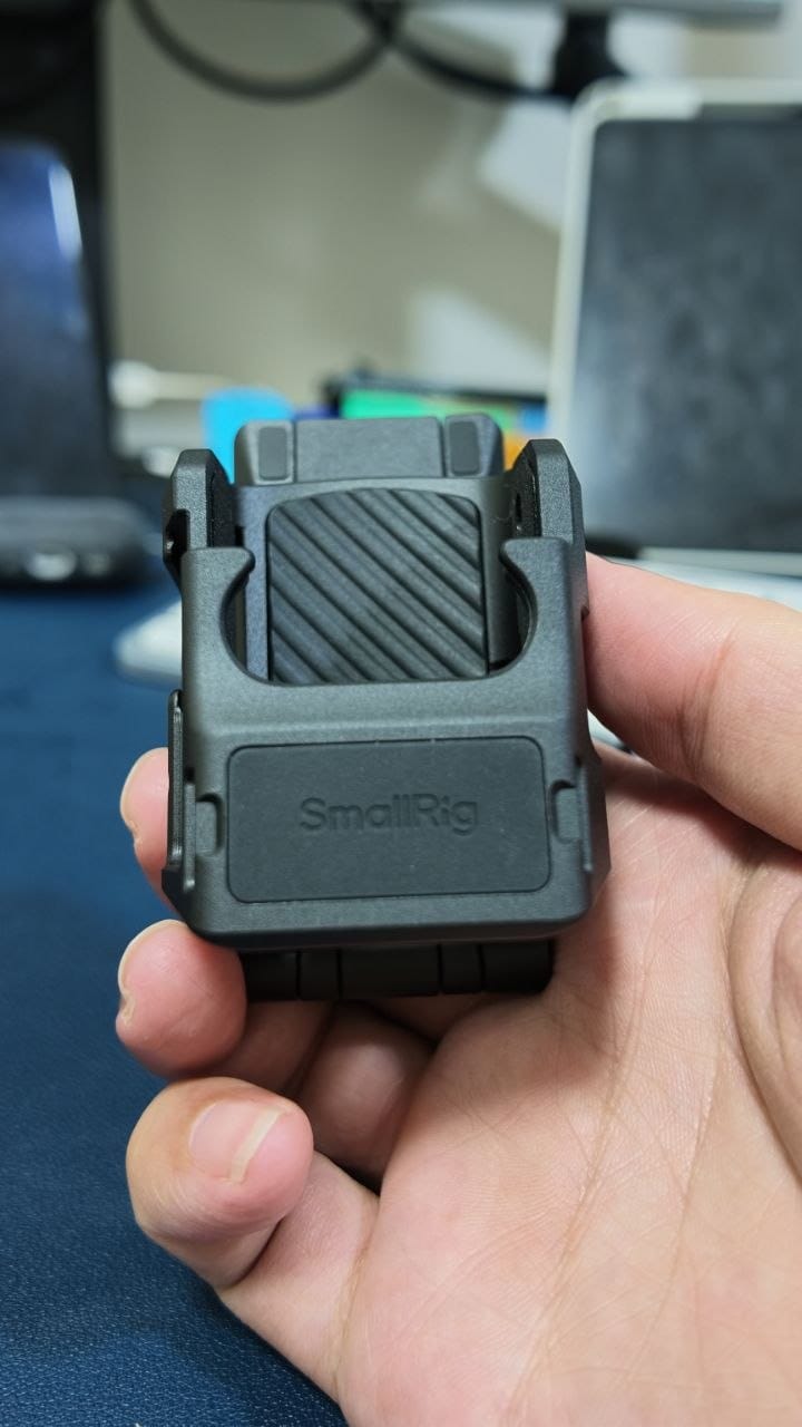 SmallRig Mount Support 6003 held in hand, showing the ribbed magnetic quick release plate