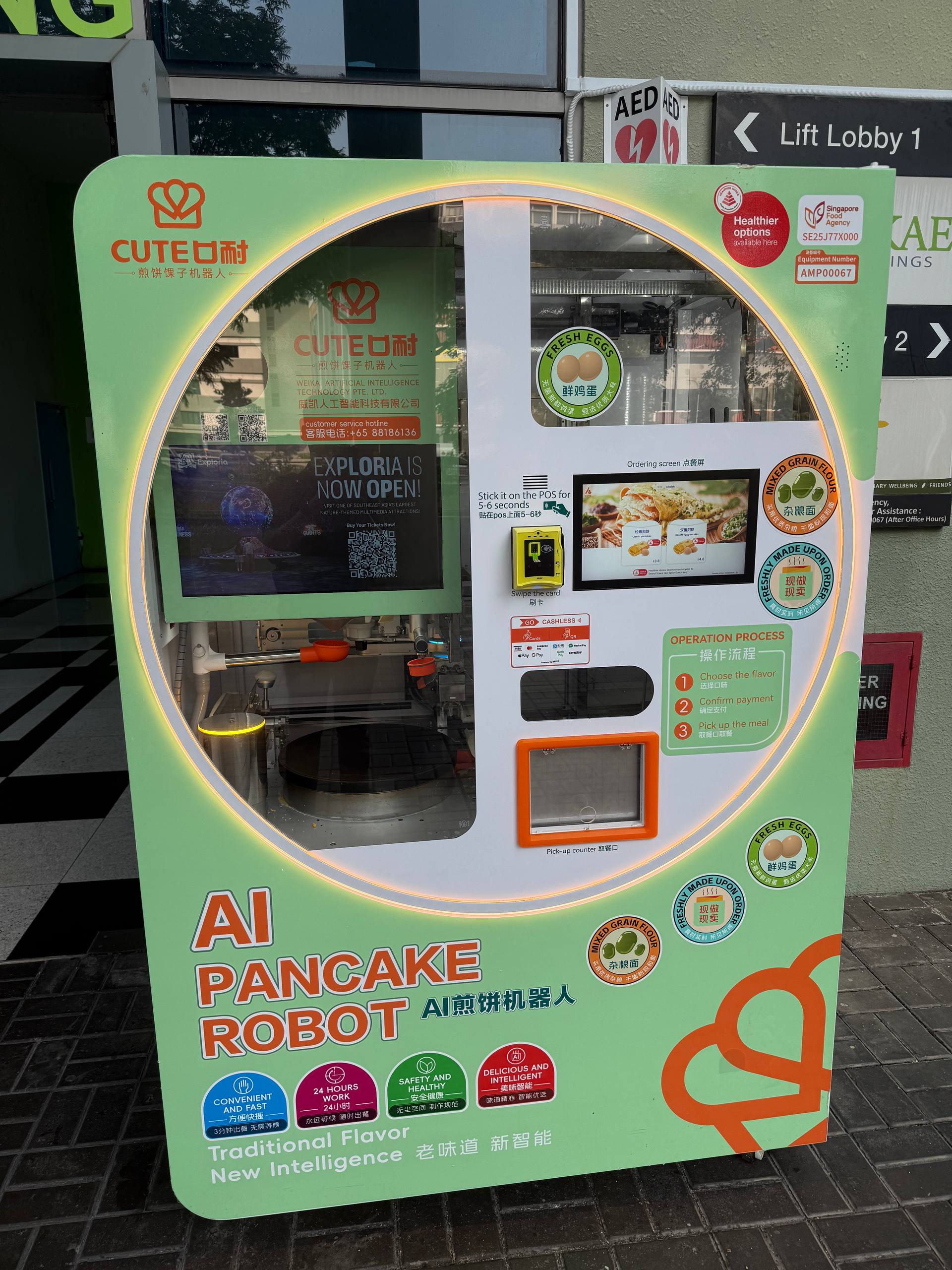 CUTE AI Pancake Robot kiosk at Mandai, showing the ordering screen, cashless payment terminal and pick-up counter